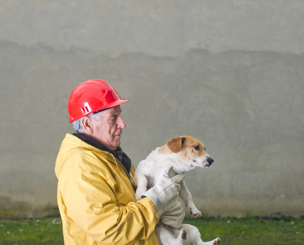 dog being rescued by an old man
