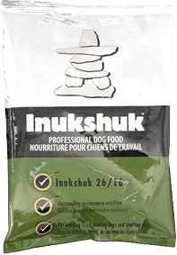 A bag of Inukshuk professional dog food with product information and a stone inukshuk graphic on the packaging.